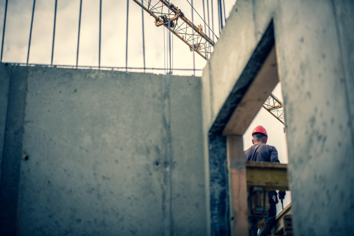 two construction workers shaking hands